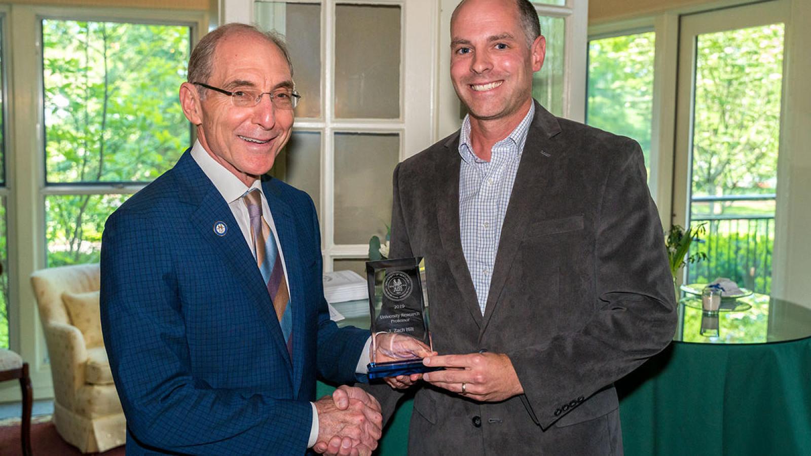 Professor accepting an award
