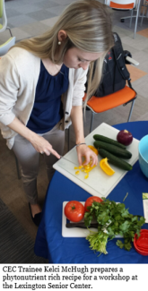 A woman slices fruit