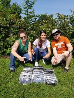 Researchers showing off work in the field