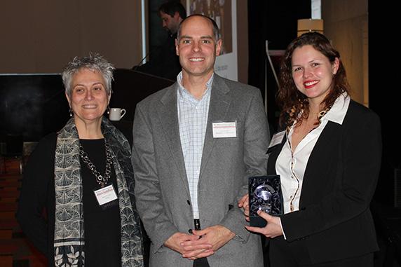 A researcher accepts an award