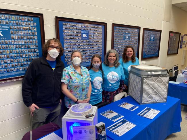 Researchers exhibiting air-filtration devices